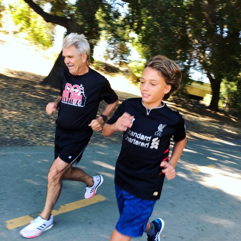 old man running with teen boy